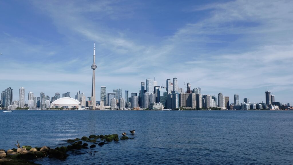 a large body of water with a city in the background