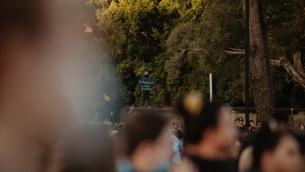 a crowd of people walking down a street